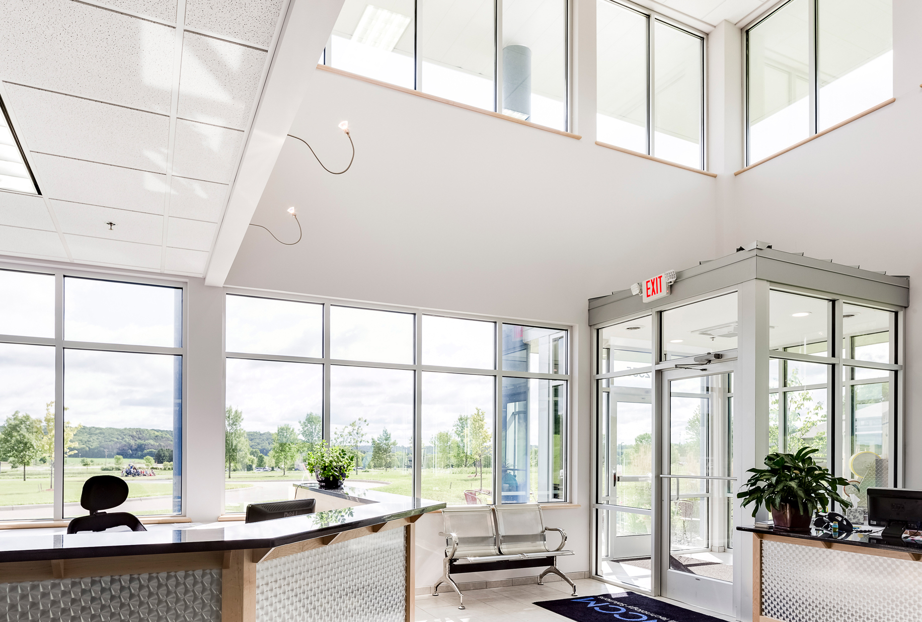 NCCM Company lobby with glazed curtain-wall windows and glass entry vestibule